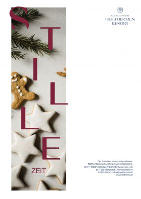 Gutschein mit dem Bild von weißen Weihnachtskugeln darauf